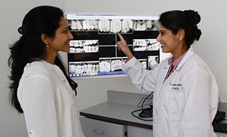 Dr. Bhave showing patient x-rays