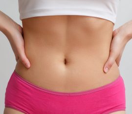 Model with smooth abdomen for tummy tuck blog