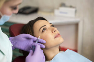 A woman getting facial fat injections in her cheeks in Westchester County, NY