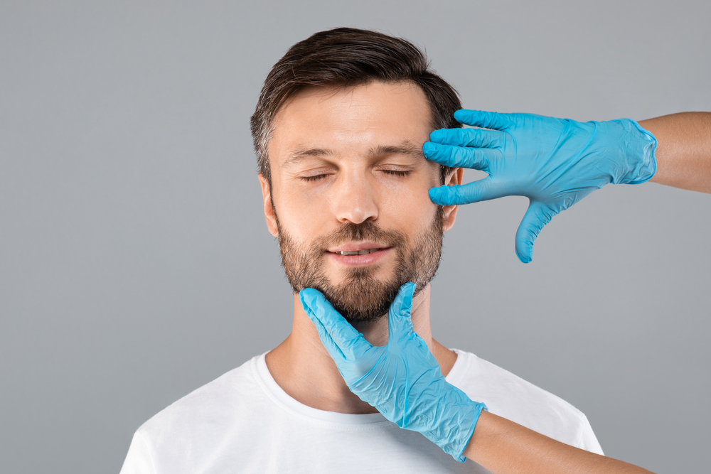 Man with a surgeon discussing brow lifts in Westchester County, NY