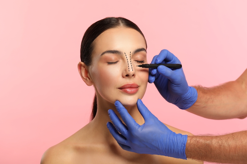 Woman getting marked by surgeon for rhinoplasty in Westchester, NY