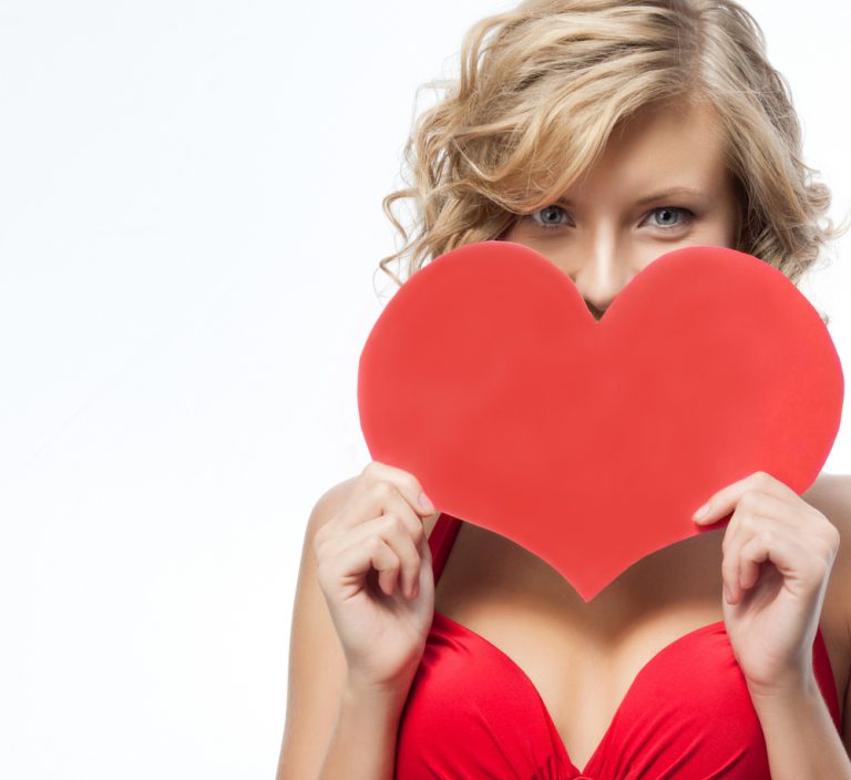 Lady in red with large red valentine card