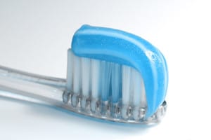 Toothbrush with blue toothpaste on it