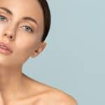 Beautiful woman tilts her head, pondering what type of facelift to get