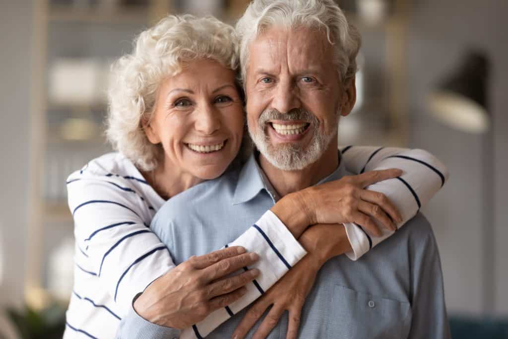 Happy older couple enjoying a glasses-free lifestyle after LAL