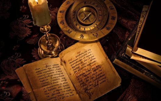 Ancient book and candle