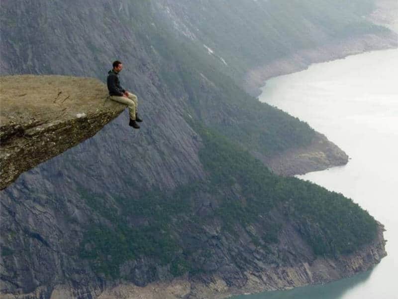 Sitting at the edge of a cliff